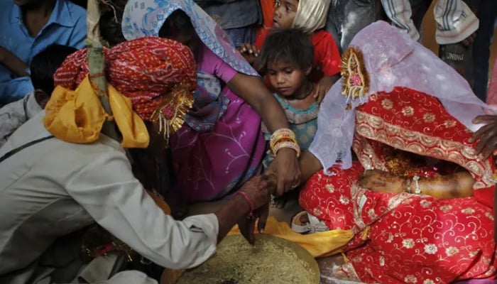 A child couple is seen at their wedding ceremony in this undated image. — Reuters