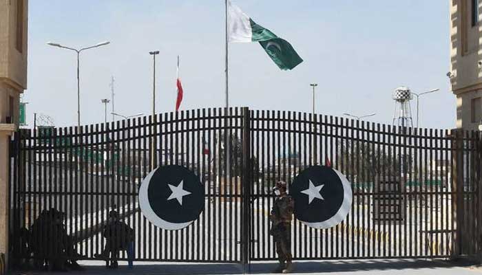 Pakistani soldiers wearing facemasks stand guard at the closed Pakistan-Iran border in Taftan, February 25, 2020. — AFP