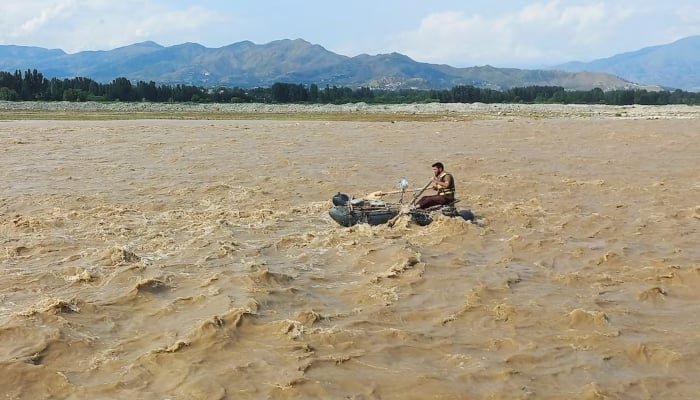 A rescue worker rows a raft while searching for survivors, after tourists, who were on a picnic, were swept away by overflowing floodwaters in the Swat River, in Swat Valley, June 27, 2025. — Reuters
